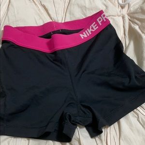 black nike pros with pink band